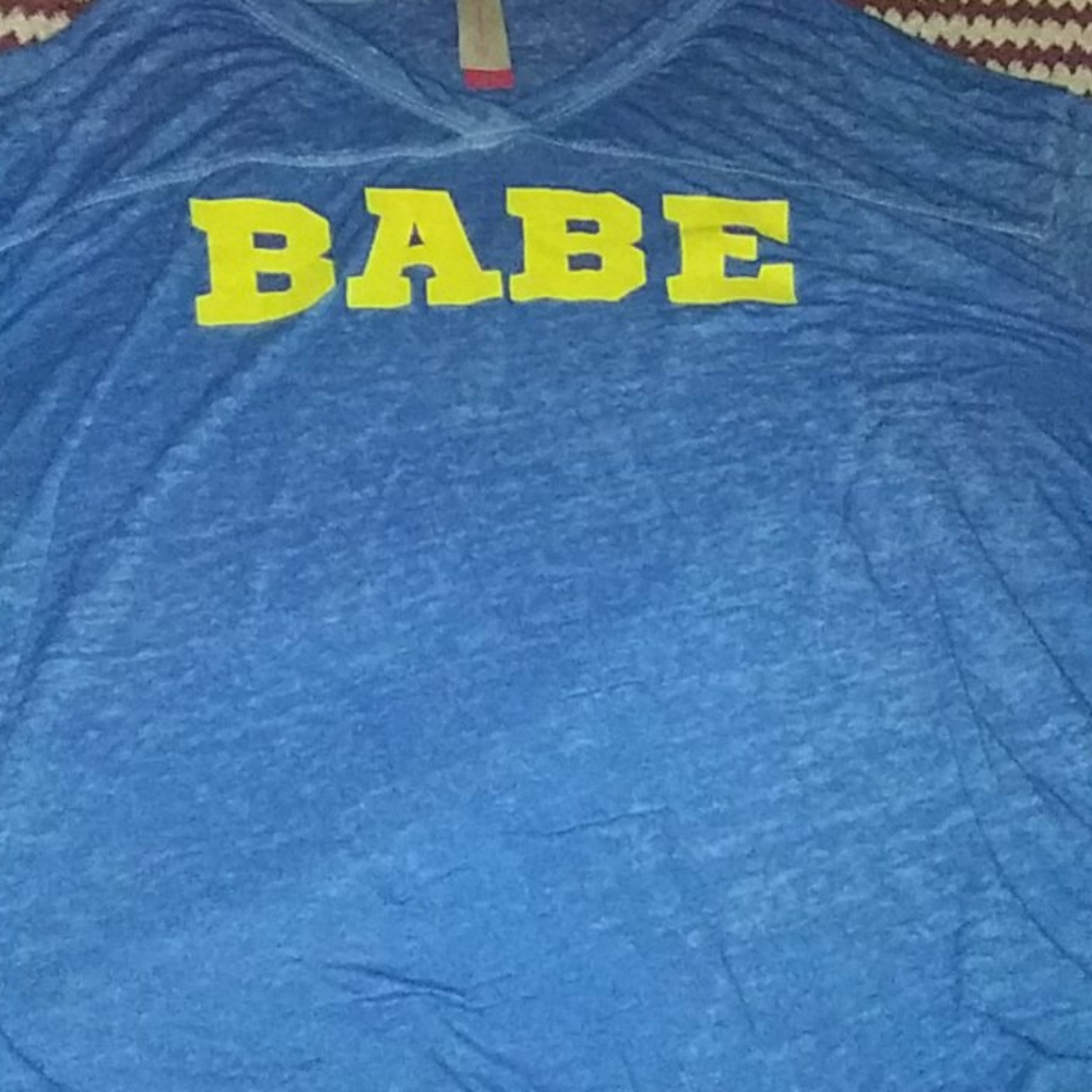 A blue and yellow tee